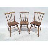 Set of three Ercol elm seated beech-framed stickback chairs (3)