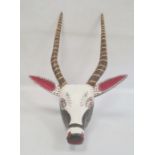 Mexican carved and painted wooden antelope mask with striped horns, red, white and black face