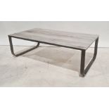 Glass-topped rectangular coffee table on black metal base, 104.5cm wide