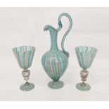 Pair of Venetian latticino glass goblets with latticino bands above the stem, with lion and