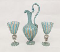 Pair of Venetian latticino glass goblets with latticino bands above the stem, with lion and