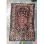 Eastern rug, dark blue ground with central peach ground medallion, foliate decorated field, multi-