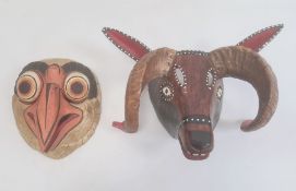Mexican carved and painted wood bird of prey mask in gilt, orange and black and another rams mask (