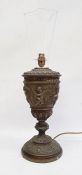 Bronze-effect table lamp, ovoid and tapering with Bacchanalian cherub decoration, on knopped
