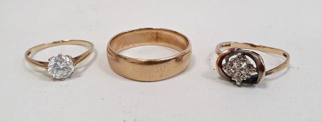 9ct gold wedding band, a 9ct gold solitaire ring set with a white stone and another 9ct gold ring,