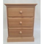 20th century pine bedside chest of three drawers, on plinth base, 49.5cm x 65.5cm