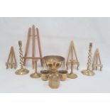 Pair of brass candlesticks, each with open spirally turned column, another pair of candlesticks,