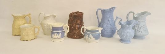 Group of Staffordshire pottery relief moulded wares, mid-19th century, comprising five jugs