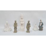 Group of Asian stone, plaster and porcelain figures, 20th century, including an Indonesian figure of