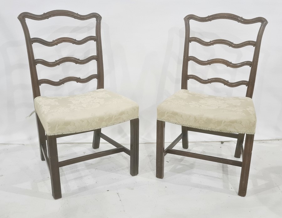 Set of eight 20th century mahogany Georgian-style dining chairs with shaped ladder backs, on moulded