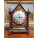 19th century rosewood bracket clock having pointed arched top and pointed square section finials,