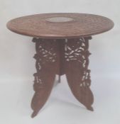 Eastern coffee table with carved and inlaid circular top, folding base