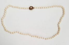 Cultured pearl necklace with 9ct gold flower-shaped clasp, set with six garnets and single pearl,