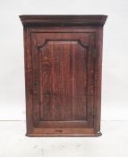 18th century oak wall-hanging corner cupboard with moulded cornice above single panelled door