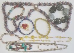 Quantity of costume jewellery including a yellow faceted bead necklace, a snake-link necklace, etc.