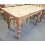 20th century pine table, the rectangular top with rounded corners, on turned supports, 121.5cm x