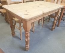 20th century pine table, the rectangular top with rounded corners, on turned supports, 121.5cm x