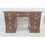 Edwardian walnut pedestal desk, the figured top with moulded edge, the central drawer flanked by