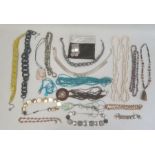 Large quantity of costume jewellery including a silver and yellow brooch, a statement bead