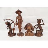 Assorted 20th century Eastern carved figures to include figure in hat carrying jug and basket,