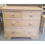 Late 19th century pine chest of two short and two long drawers, the rectangular top with applied