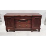 19th century breakfront mahogany sideboard with three drawers flanked by cupboard door, on turned