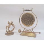 Late Victorian/Edwardian brass dinner gong on stand with beater and a metal gold painted Art Deco