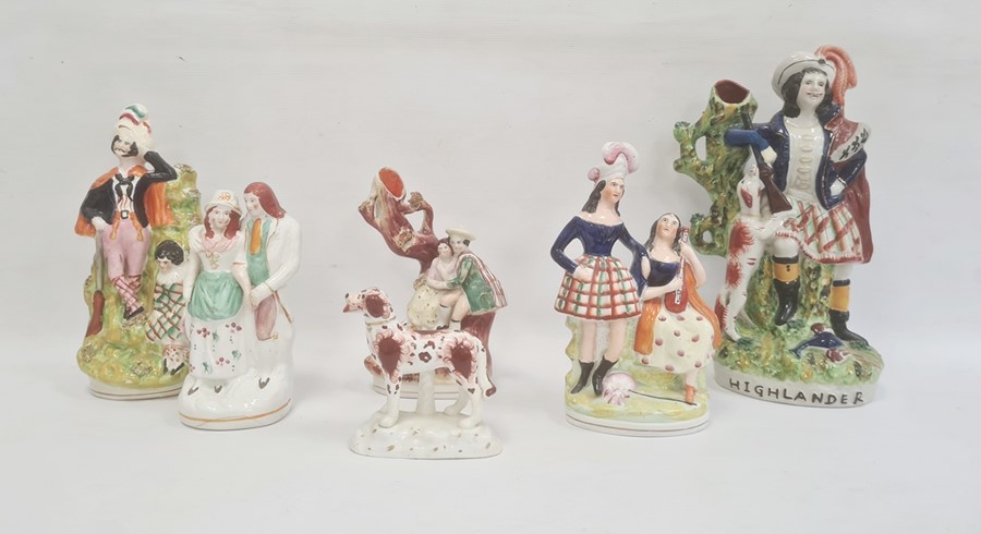 Six Staffordshire pottery figures, mid 19th century, comprising a highlander spill vase, 32cm