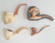 Three meerschaum and amber pipes, two turbanned gentleman, Edwardian lady with feathered bonnet
