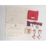 Three British Red Cross medals, boxed and a lady's 1935 Silver Jubilee medal and miniature, boxed