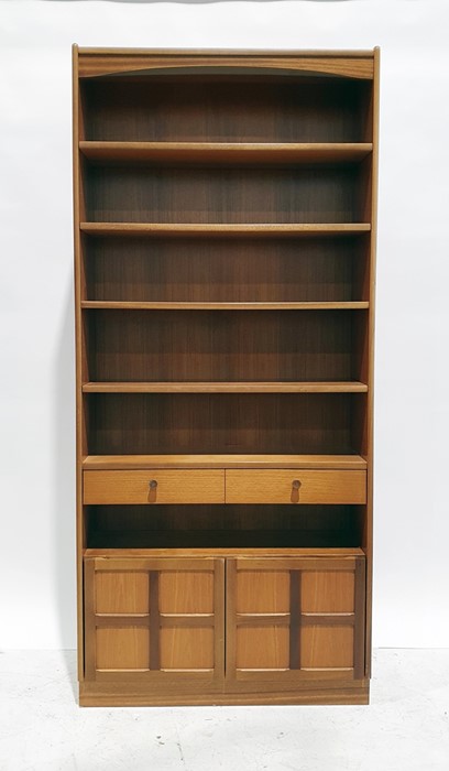 20th century Nathan teak bookcase with assorted shelves above drawer and two cupboard doors, on