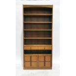 20th century Nathan teak bookcase with assorted shelves above drawer and two cupboard doors, on