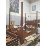 19th century four-poster bed with square section posts to each corner, shaped and carved