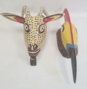 Mexican carved and painted wood antelope mask in yellow, black, white and red with spots, with old