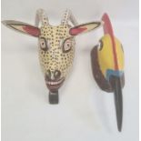 Mexican carved and painted wood antelope mask in yellow, black, white and red with spots, with old