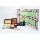 Milestones Game of Life, a vintage Gordons gin bottle, Rhodian cigarette tin, pair of servers and