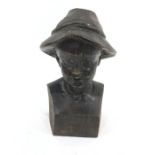 Late 19th/early 20th century hand carved bust of boy wearing feathered hat, 30cm high approx