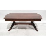 20th century mahogany coffee table on turned end pillar supports united by stretcher, 122cm wide