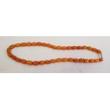 Short string of yellow amber beadsCondition ReportApprox. weight 10.6g
