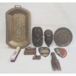 African carved ebony mask comb, an Eastern brass tray, two painted metal shield wall plaques and