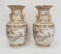 Pair of Chinese porcelain vases, each angular baluster shape and painted in panels with hunting