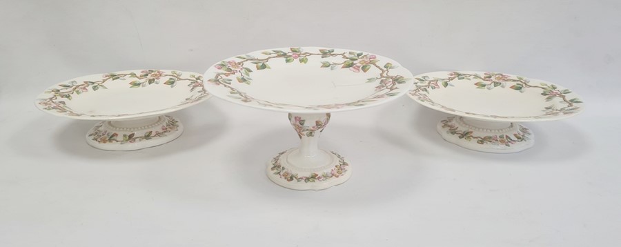 Three Royal Worcester comports, circa 1880, printed puce marks, comprising one tall footed comport