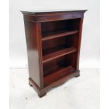 20th century mahogany open bookcase, the rectangular top with ogee moulded cornice, fluted