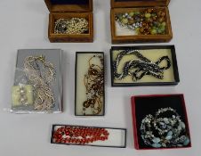 Carved hardwood box and contents including cloisonne enamel beads and other items of costume