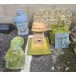 Collection of Eastern inspired garden ornaments to include blue painted head, seated Buddha, etc (6)