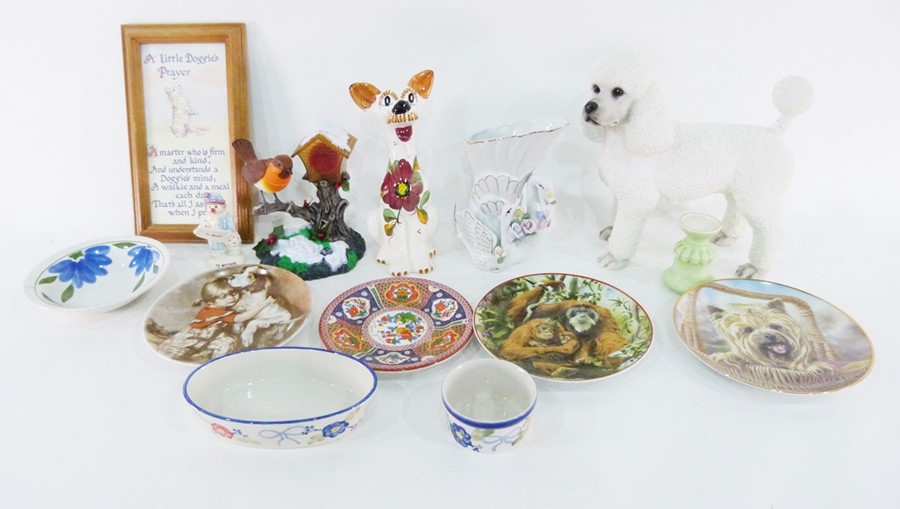 Resin model of a poodle, a pottery model of a comical dog, other ornaments, a mirror, a clock, model
