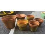 Six terracotta plant pots of various sizes, largest 47cm diameter (6)