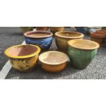 Five glazed circular garden planters in various colours, largest 48cm diameter (5)