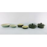 Collection of green and cream Le Creuset ceramic (stoneware) cookware including two lidded