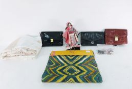 Assorted table linen, two handbags, quilt, doll in Japanese traditional dress and storage baskets
